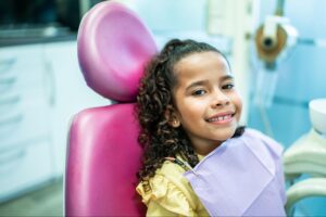 Child smiling in orthodontic chair at BZ Orthodontics, showcasing a welcoming environment for Invisalign and braces consultations in Lansdale, PA.