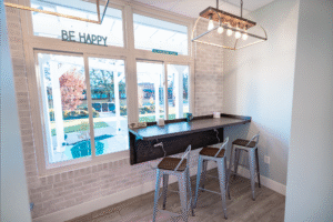 Bright and inviting BZ Orthodontics office interior featuring a bar seating area with stools, large windows, and motivational decor, emphasizing patient comfort in Lansdale, PA.