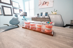 Orthodontic office setting at BZ Orthodontics featuring display of Invisalign and braces models, emphasizing treatment options in Lansdale, PA.