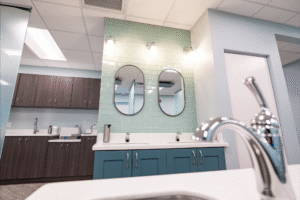 Modern orthodontic office interior at BZ Orthodontics, featuring stylish cabinetry, mirrors, and a clean, inviting atmosphere for patients seeking Invisalign and braces in Lansdale, PA.