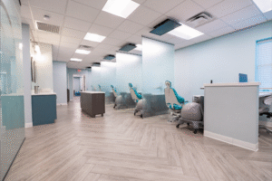 Modern orthodontic office interior at BZ Orthodontics in Lansdale, featuring dental chairs and a calming blue color scheme, highlighting services like Invisalign and braces.