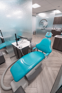 Dental treatment chair in BZ Orthodontics office, featuring modern equipment and a calming turquoise design, relevant for patients seeking orthodontic services like Invisalign in Lansdale, PA.
