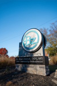 BZ Orthodontics sign featuring Dr. Brian Zebriek, DDS, MS, highlighting community orthodontic services in Lansdale, PA.