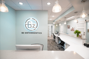 BZ Orthodontics office interior featuring modern design, reception area, and logo, representing orthodontic services in Lansdale, PA, including Invisalign and braces.