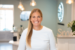 Smiling female patient in BZ Orthodontics office, showcasing orthodontic care environment, highlighting services like Invisalign in Lansdale, PA.