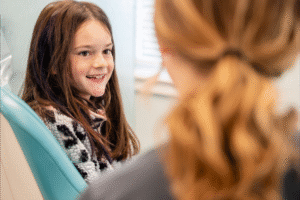 Child smiling during consultation at BZ Orthodontics, showcasing friendly atmosphere for orthodontic care in Lansdale, PA.