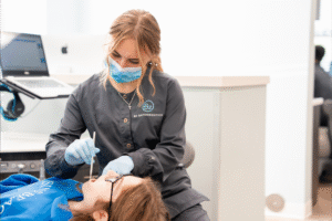 Dental assistant providing care to a patient at BZ Orthodontics, demonstrating orthodontic treatment options in Lansdale, PA, including braces and Invisalign.