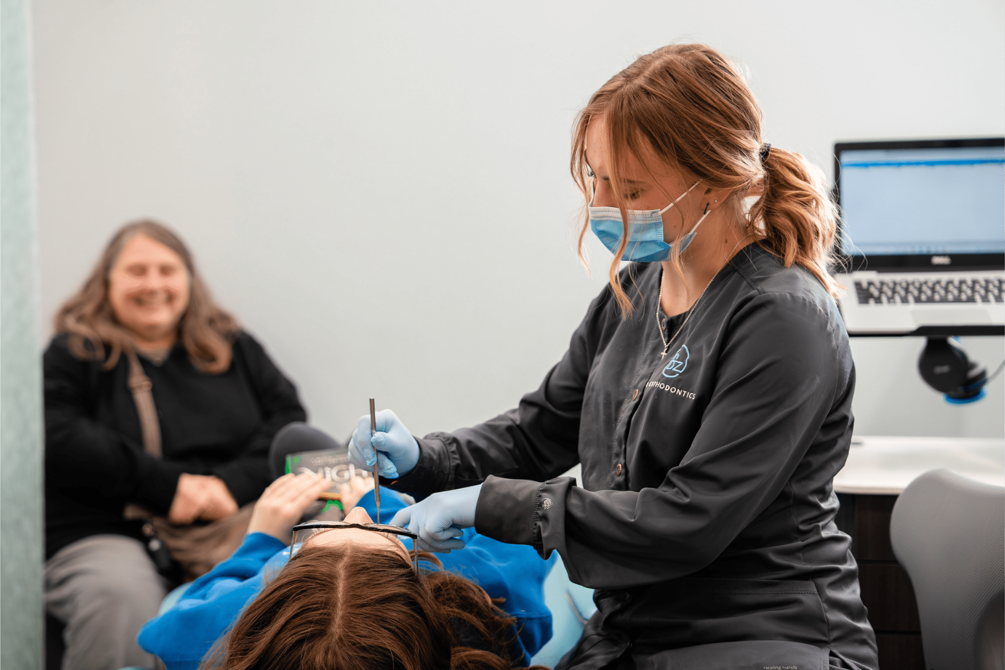 Dental assistant treating a patient at BZ Orthodontics, showcasing orthodontic care in Lansdale, with a focus on braces and Invisalign options.