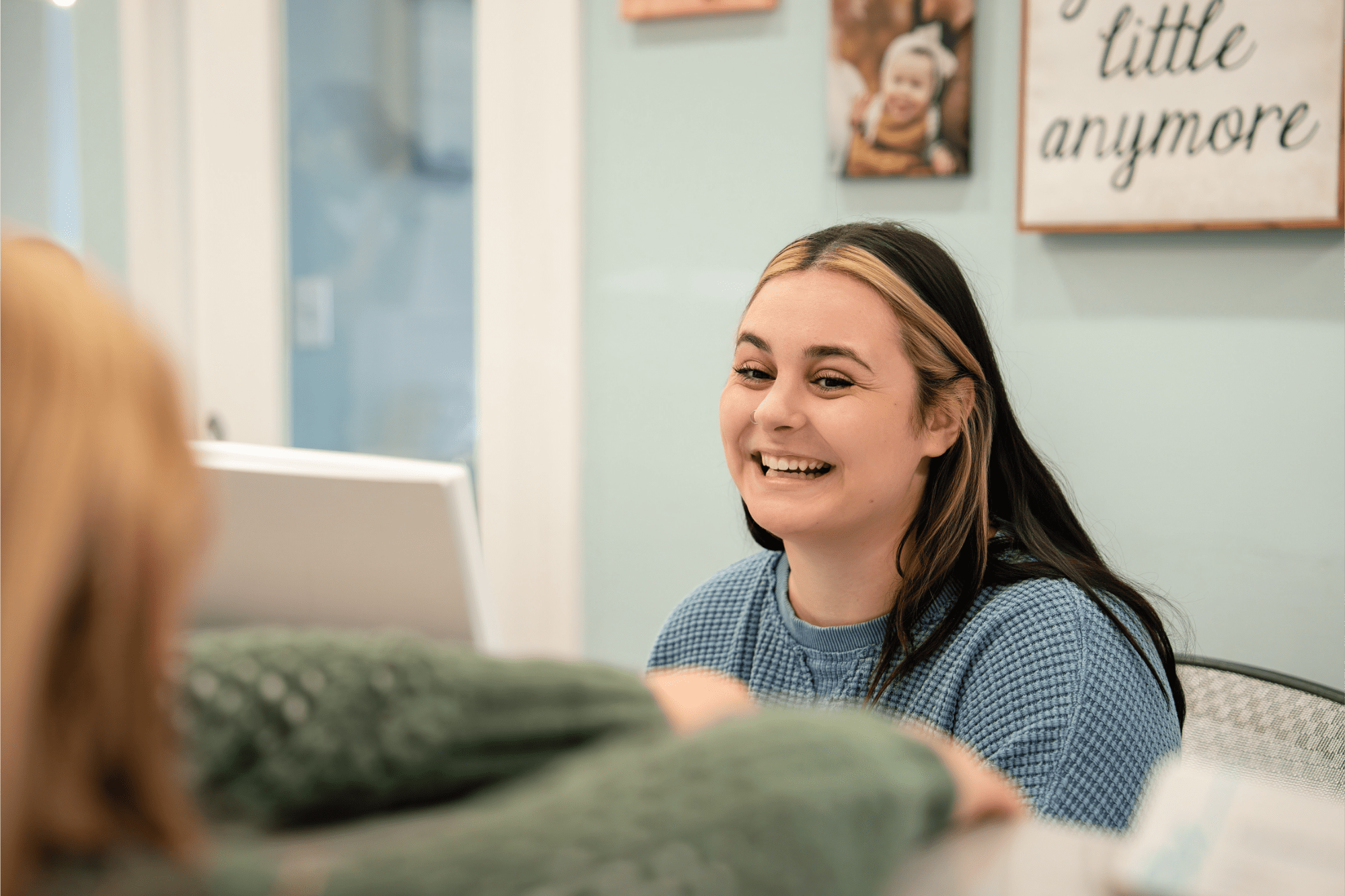 Smiling receptionist at BZ Orthodontics welcoming a patient in a modern office setting, emphasizing comfort and care for orthodontic services in Lansdale, PA.