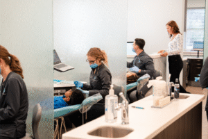 Dental professionals providing patient care at BZ Orthodontics, featuring Invisalign treatment and a welcoming clinic environment in Lansdale, PA.