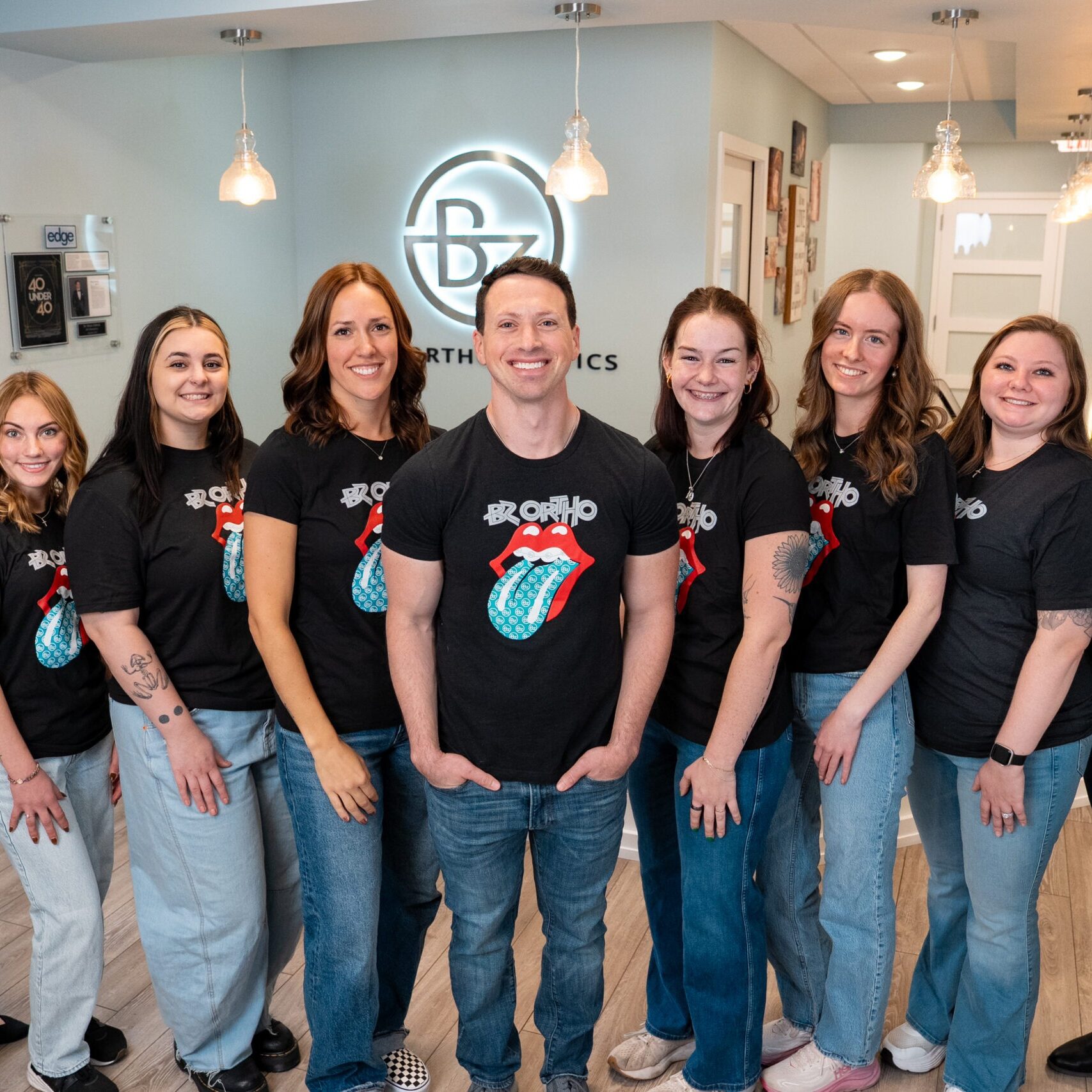 Dr. Brian Zebrick and the BZ Orthodontics team standing together in the office