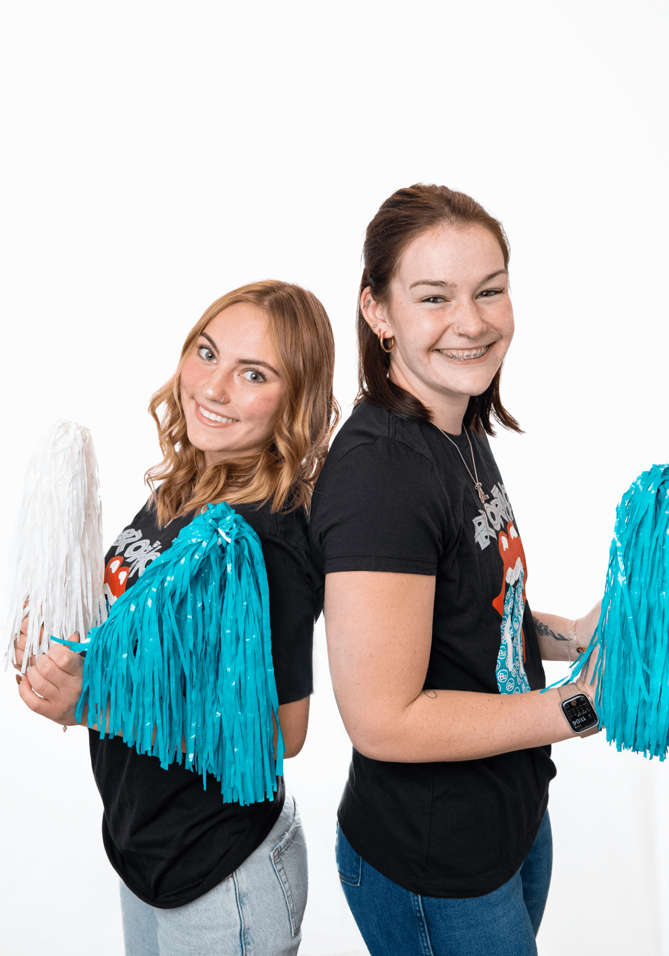 bz ortho-team-headshots-fun-03 Two cheerful staff members at BZ Orthodontics, holding blue and white pom-poms, showcasing a friendly and welcoming atmosphere for patients seeking orthodontic care in Lansdale, PA.
